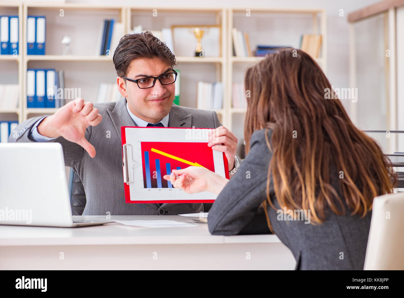 Business meeting between businessman and businesswoman Stock Photo - Alamy
