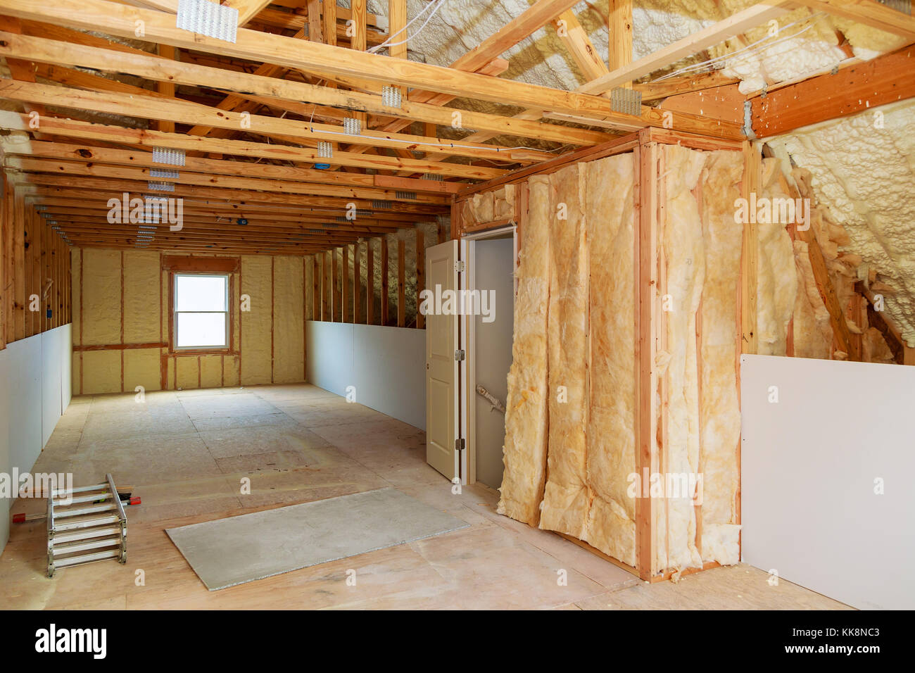 thermal and hidro insulation Inside wall insulation in wooden house, building under construction Stock Photo