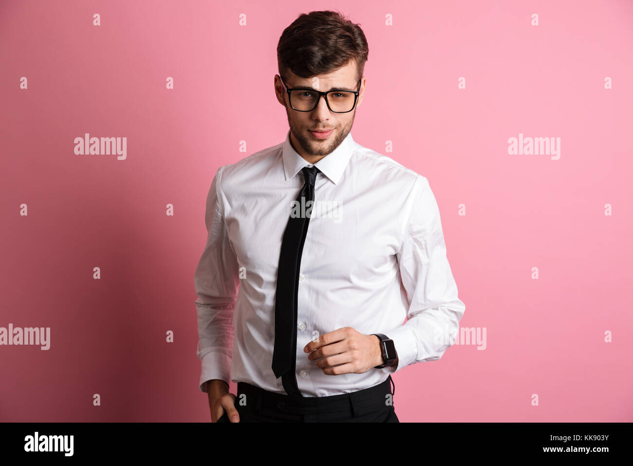 Portrait of a confident charming man in white shirt and eyewear looking ...