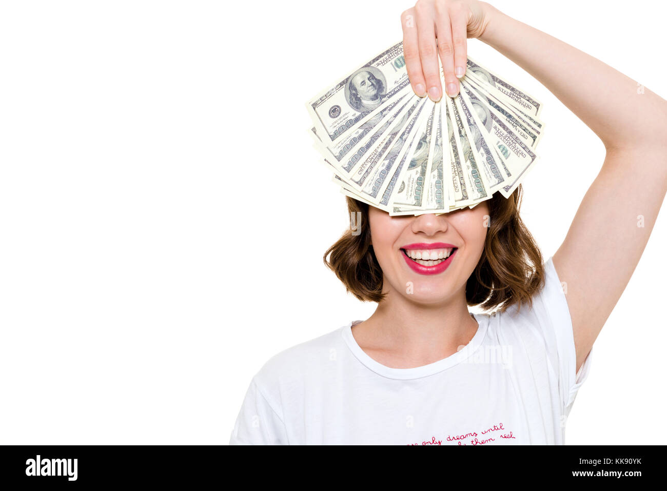 Close up portrait of a smiling happy girl holding bunch of money ...