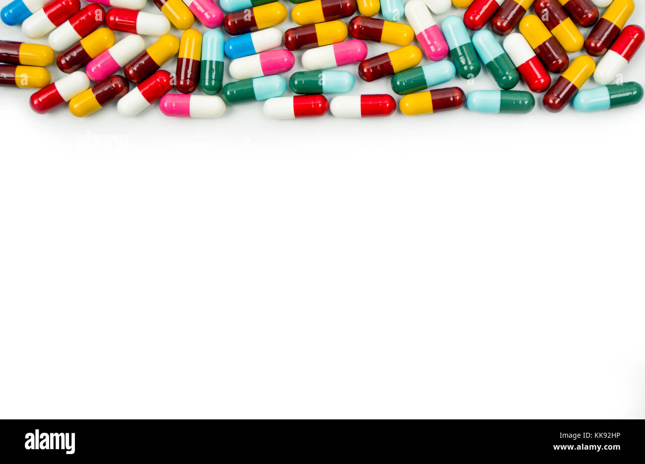 Colorful of antibiotic capsules pills isolated on white background with