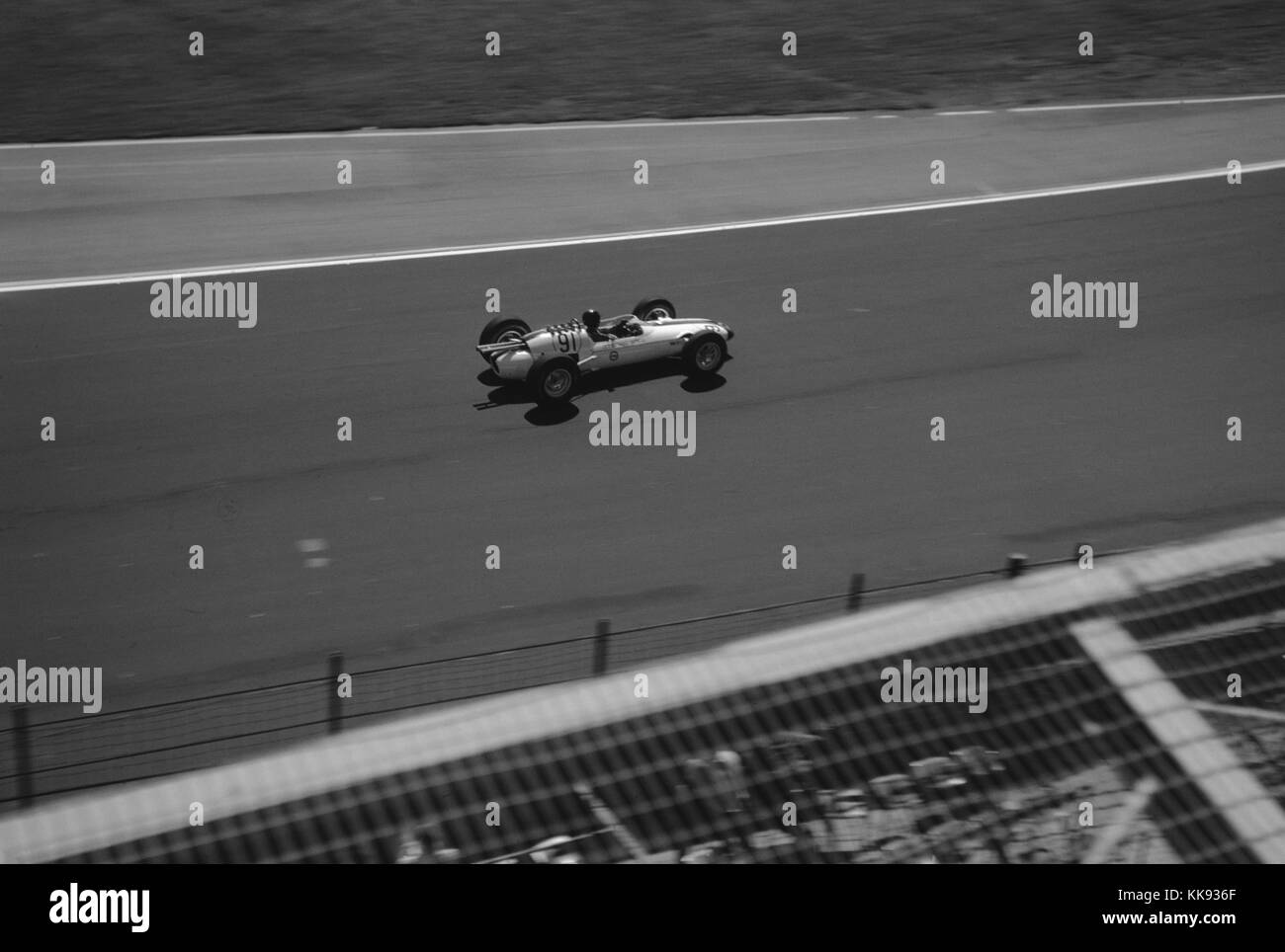 Race car driver Dan Gurney driving car 91, a Lotus powered by a Ford engine, during a qualifying lap for the Indianapolis 500 race at Indianapolis Motor Speedway, Indianapolis, Indiana, May 30, 1963. Stock Photo