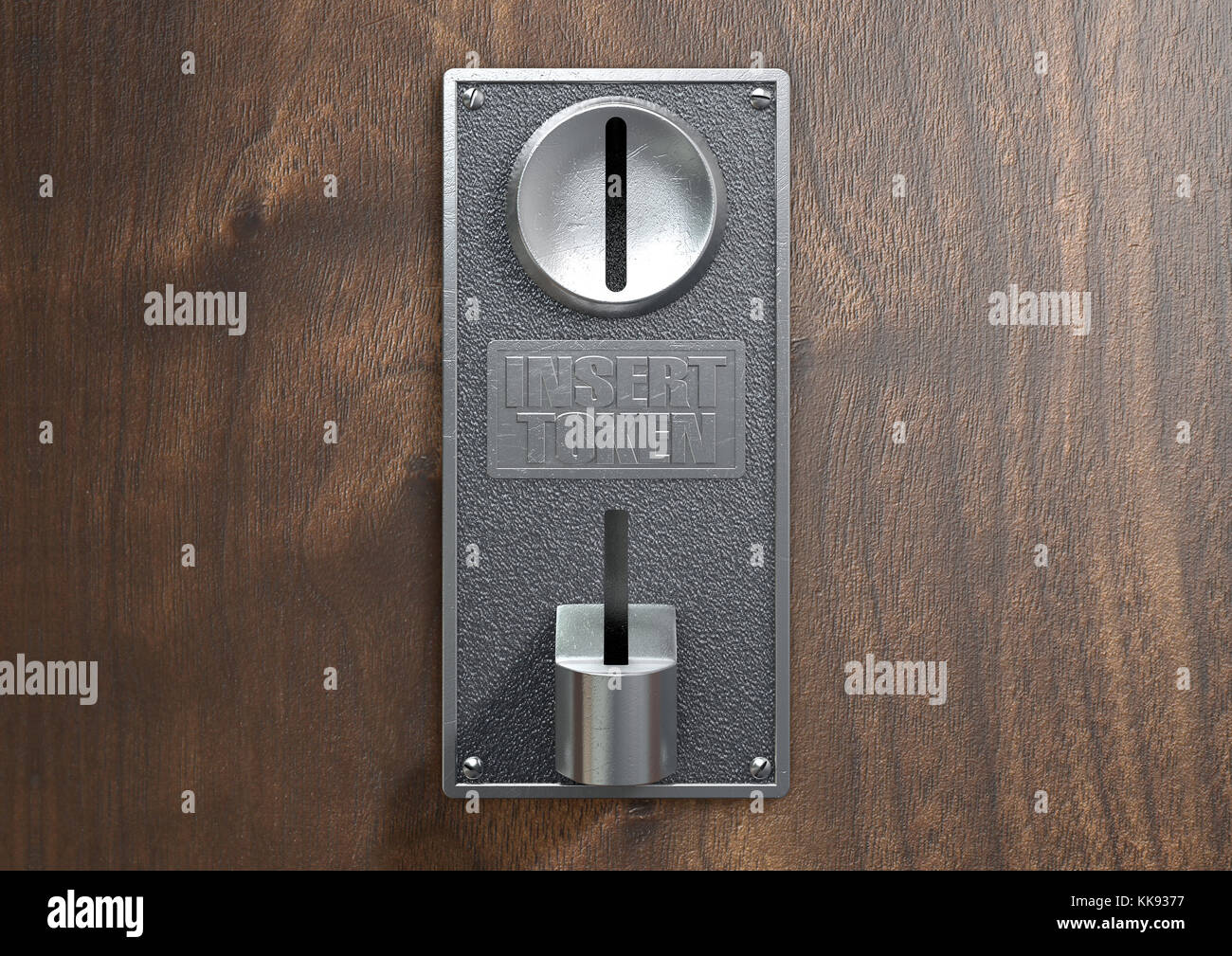 A vintage metal coin receptacle slot panel from a coin operated machine with entry and exit slots mounted on a wooden surface Stock Photo