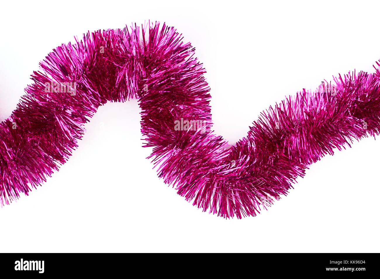 Christmas pink tinsel on white background Stock Photo - Alamy