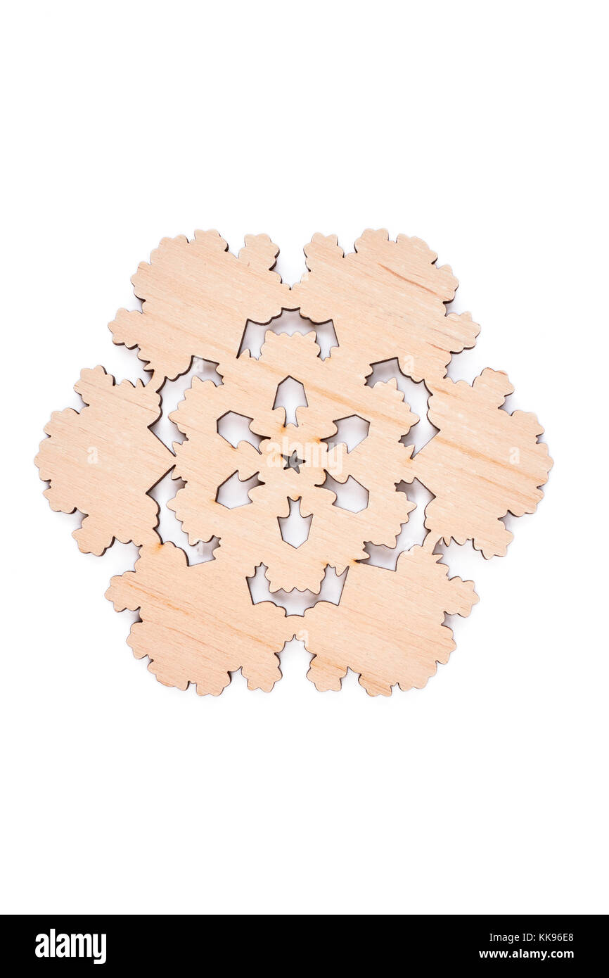 Wooden snowflake on white background. Stock Photo