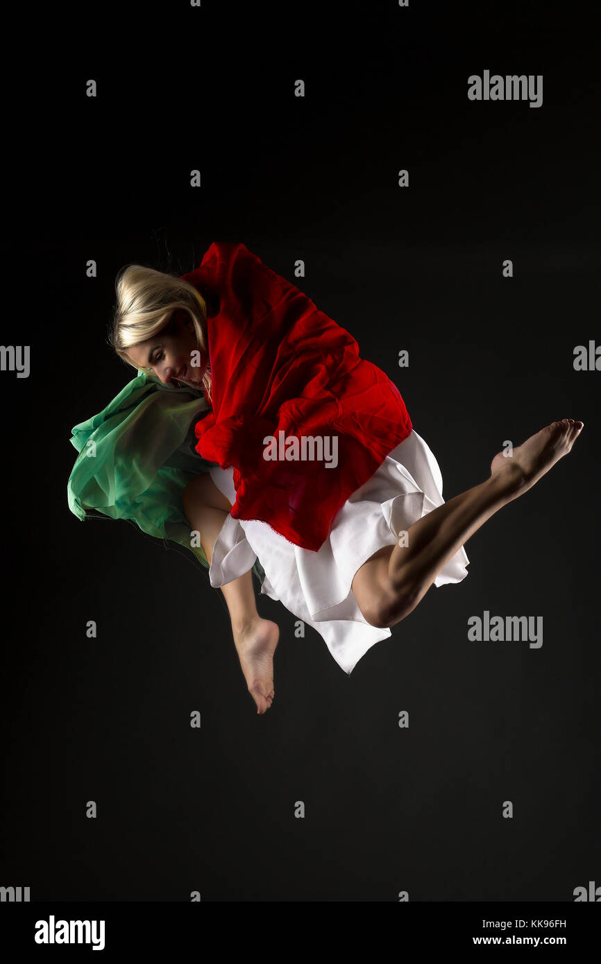 Studio dancing female mid air jumps Stock Photo