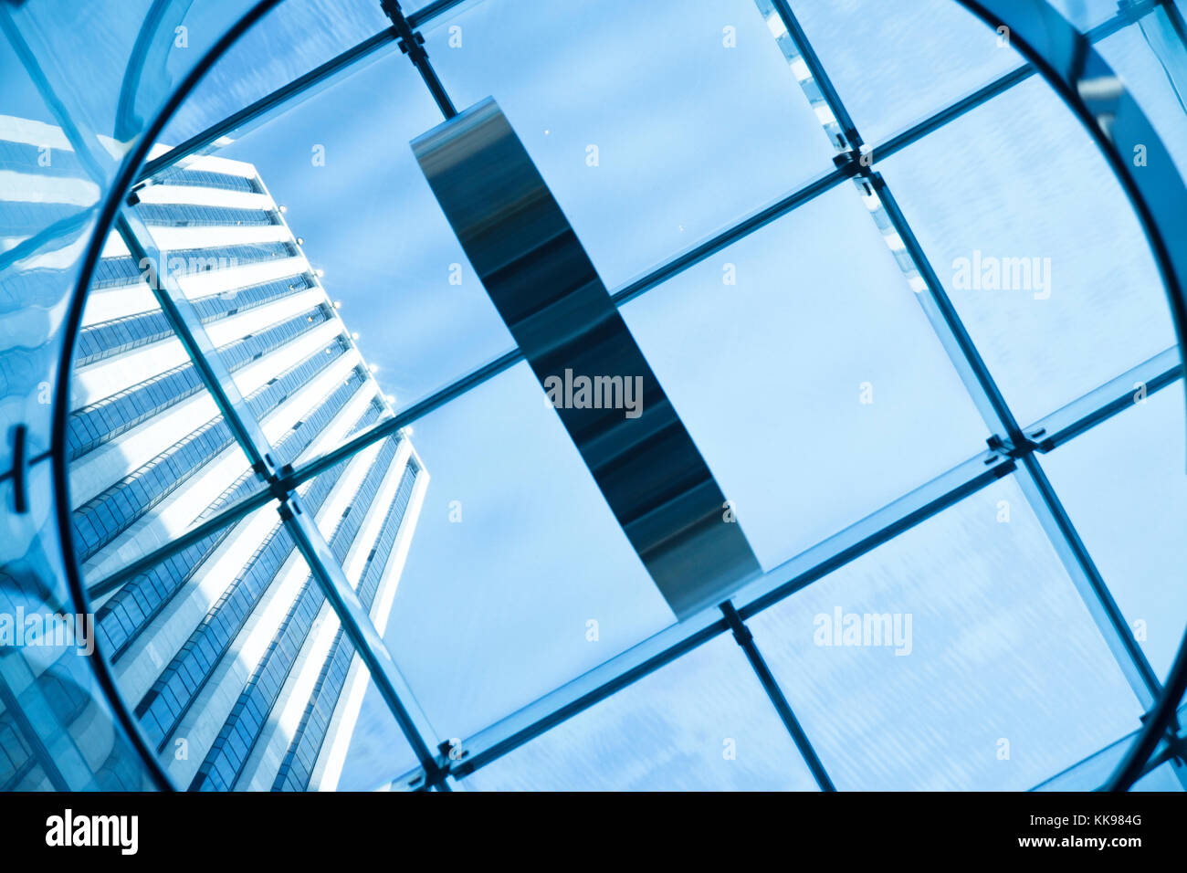 Glass Building Seeing In Modern glass building seen through glass ceiling Stock Photo - Alamy