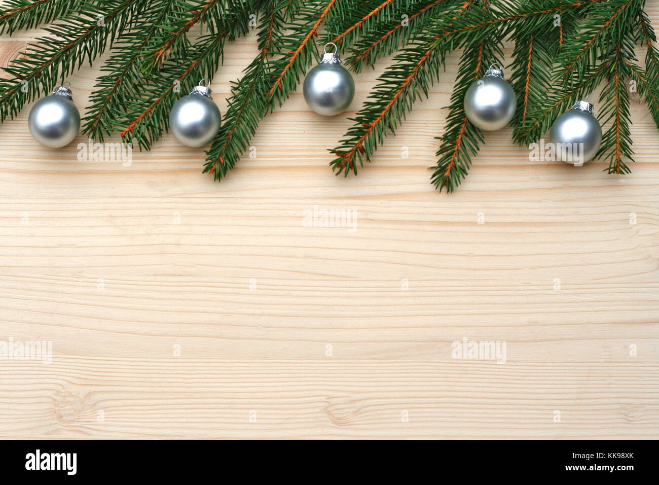 vintage Christmas background with fir branches and silver balls on wood Stock Photo