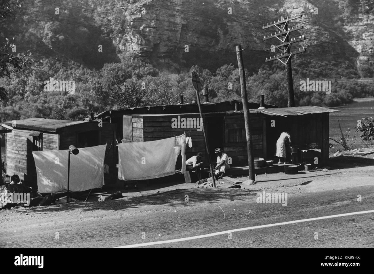 Black and white photograph of shacks inhabited by African-Americans along highway between Charleston and Gauley Bridge, West Virginia, September, 1938. From the New York Public Library. Stock Photo