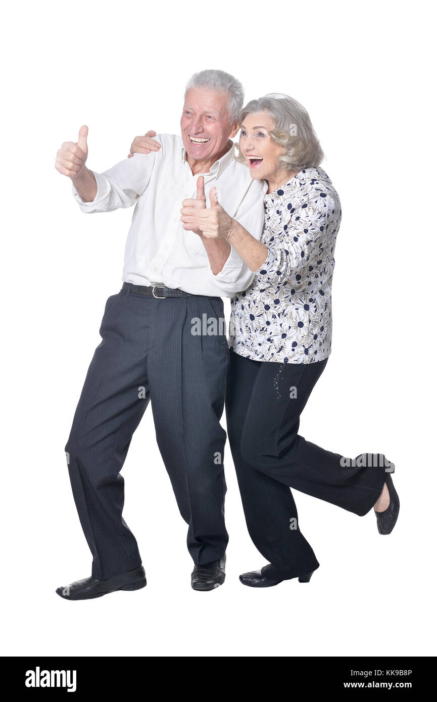Senior couple showing thumbs up Stock Photo - Alamy
