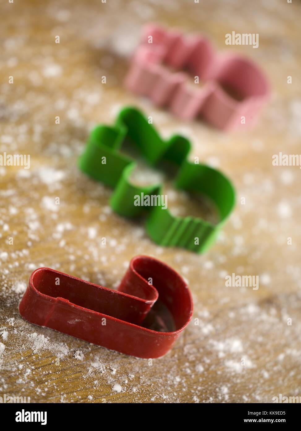 cookie cutters and flour on worktop Stock Photo Alamy