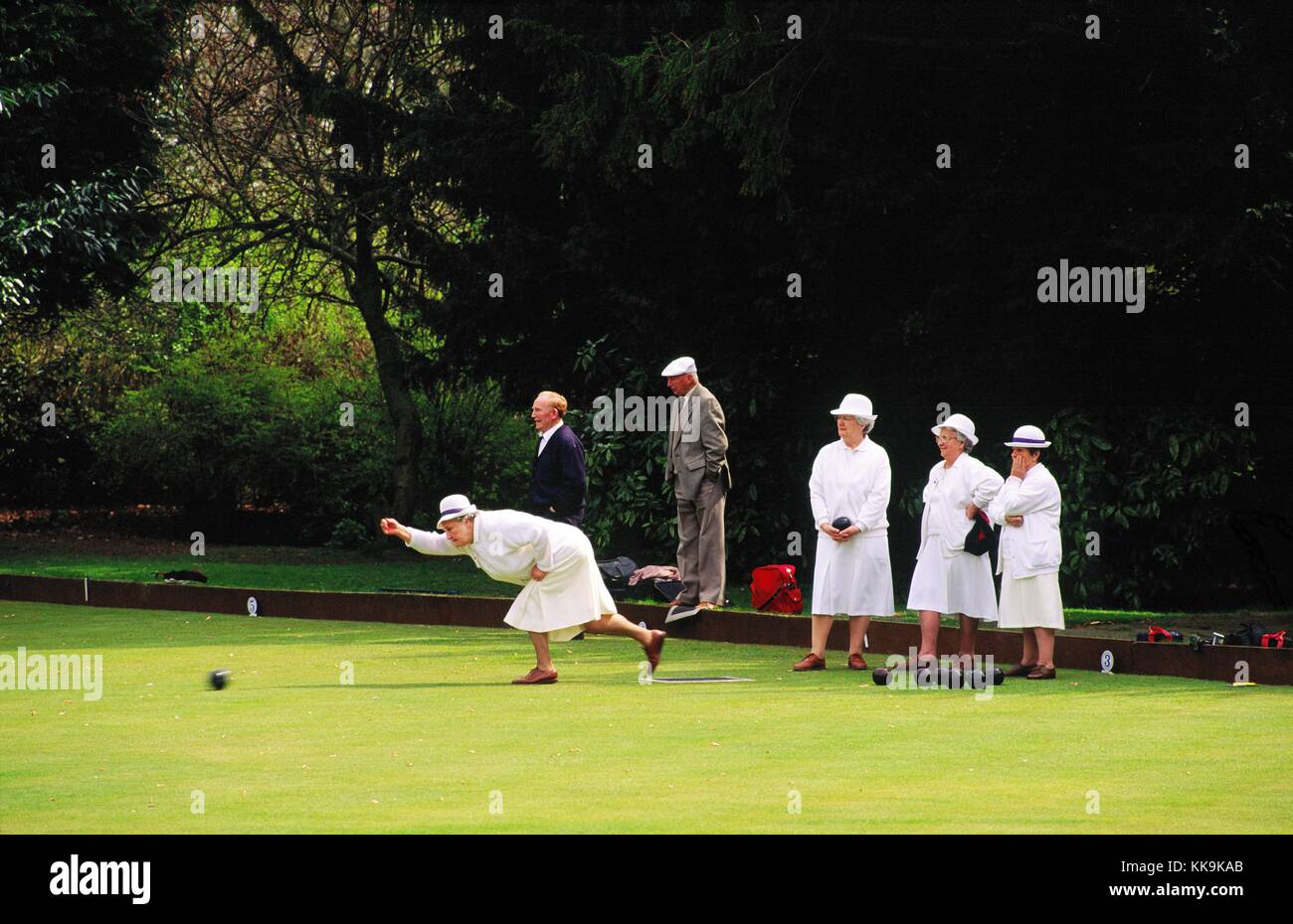English ladies and gentlemen playing crown green bowling in the town of Barnard Castle, County