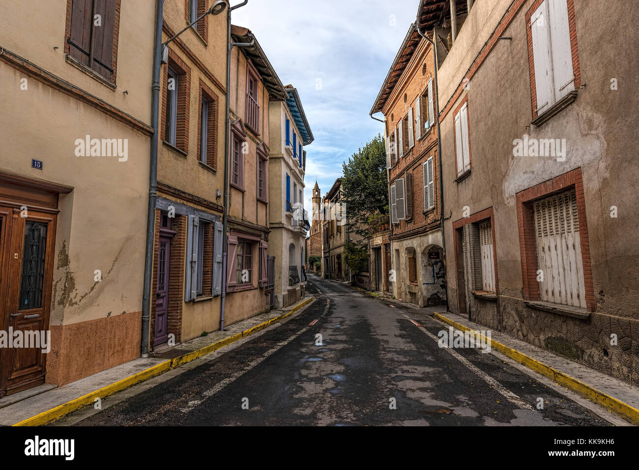 Street leading to main cathedral in the distance of an old town in southern France, Rabastens,Tarn, Midi-Pyrenees Stock Photo