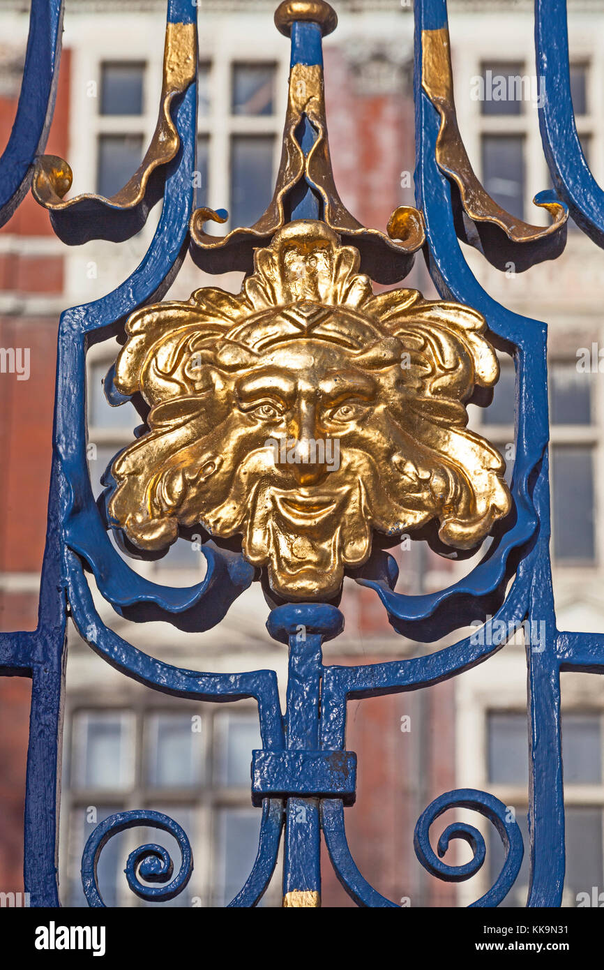 London, City of Westminster   A gilded grotesque on the North or Cavendish Gates of Green Park in Piccadilly Stock Photo