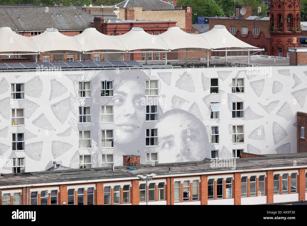Faces on the side of building in Birmingham. Stock Photo