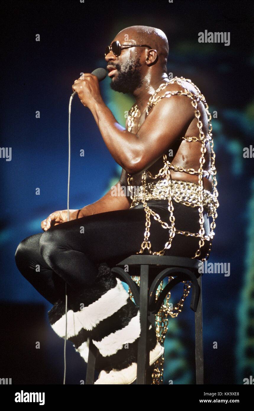 The US American soul singer Isaac Hayes sings a song while sitting on stage at International Music Festival in Cannes in 1973. | usage worldwide Stock Photo