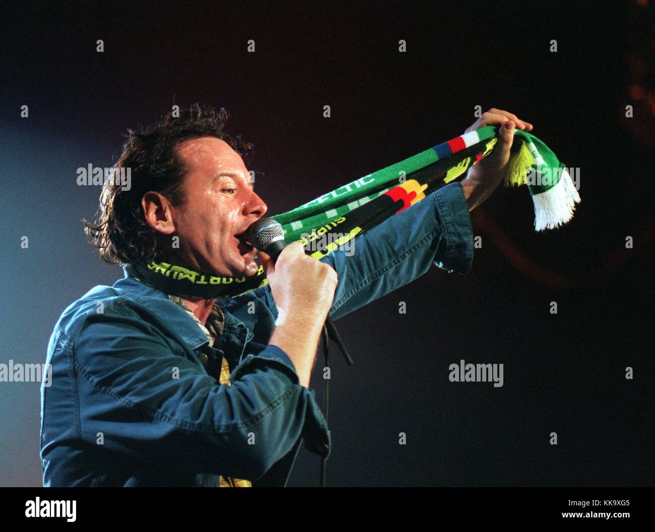 Simple Minds" vocalist Jim Kerr wears a scarf in the colours of football  club Borussia Dortmund