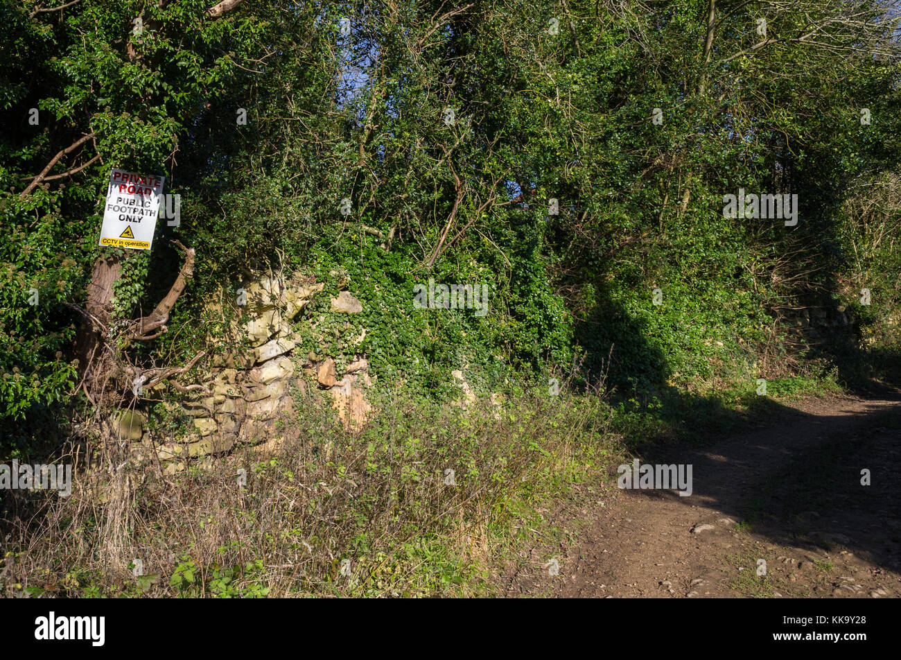 Private road and public footpath only sign. Stock Photo