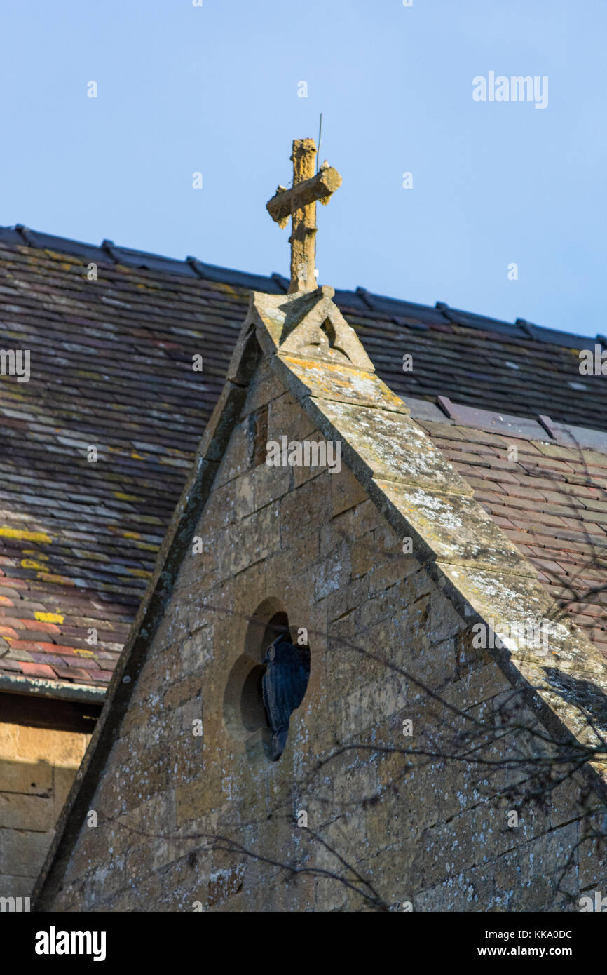 Stone cross on St Lawrences Church, Mickleton Stock Photo