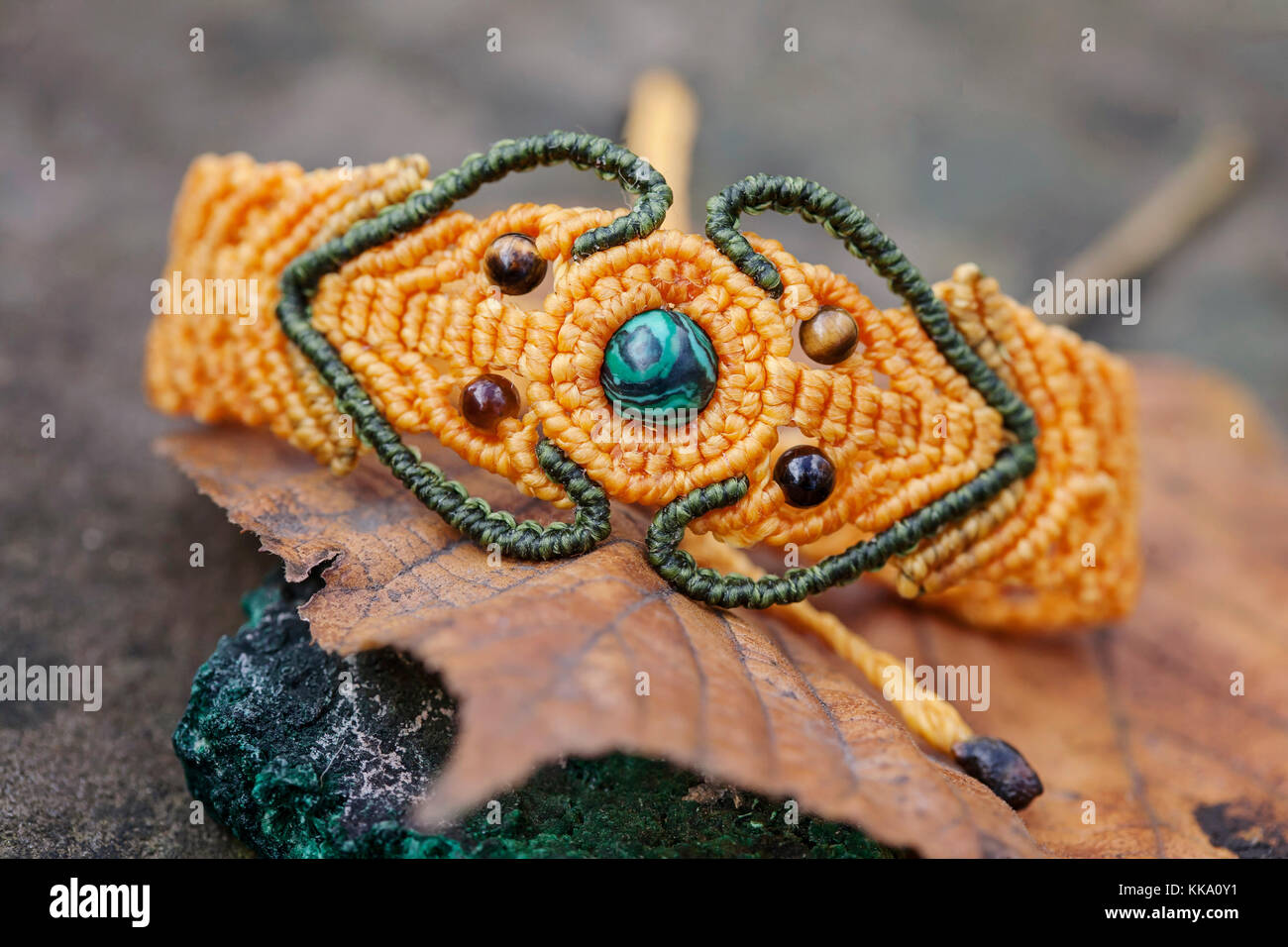 Macrame material handmade bracelet on natural background Stock Photo - Alamy