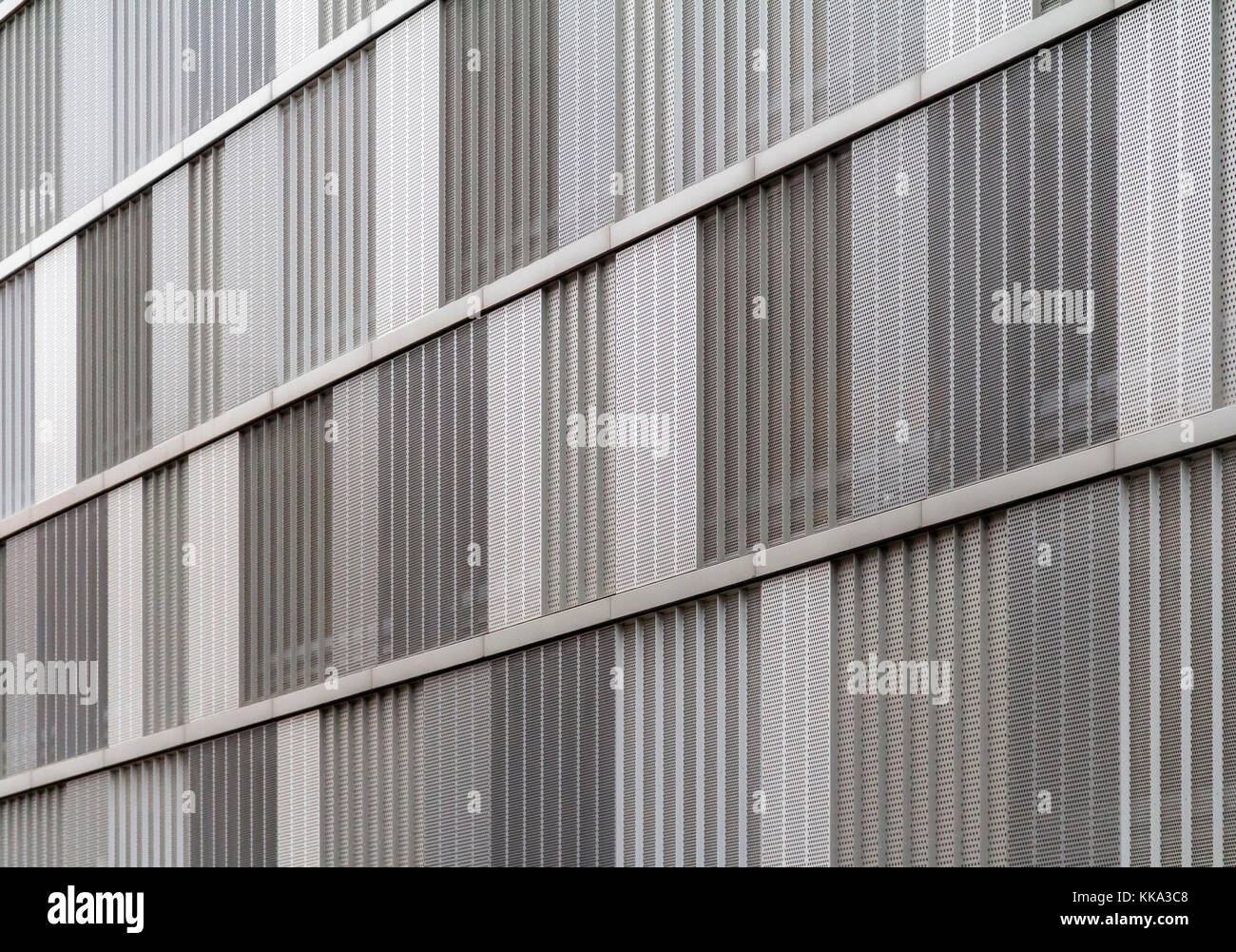 full frame detail of a house facade cased with metallic perforated plates Stock Photo