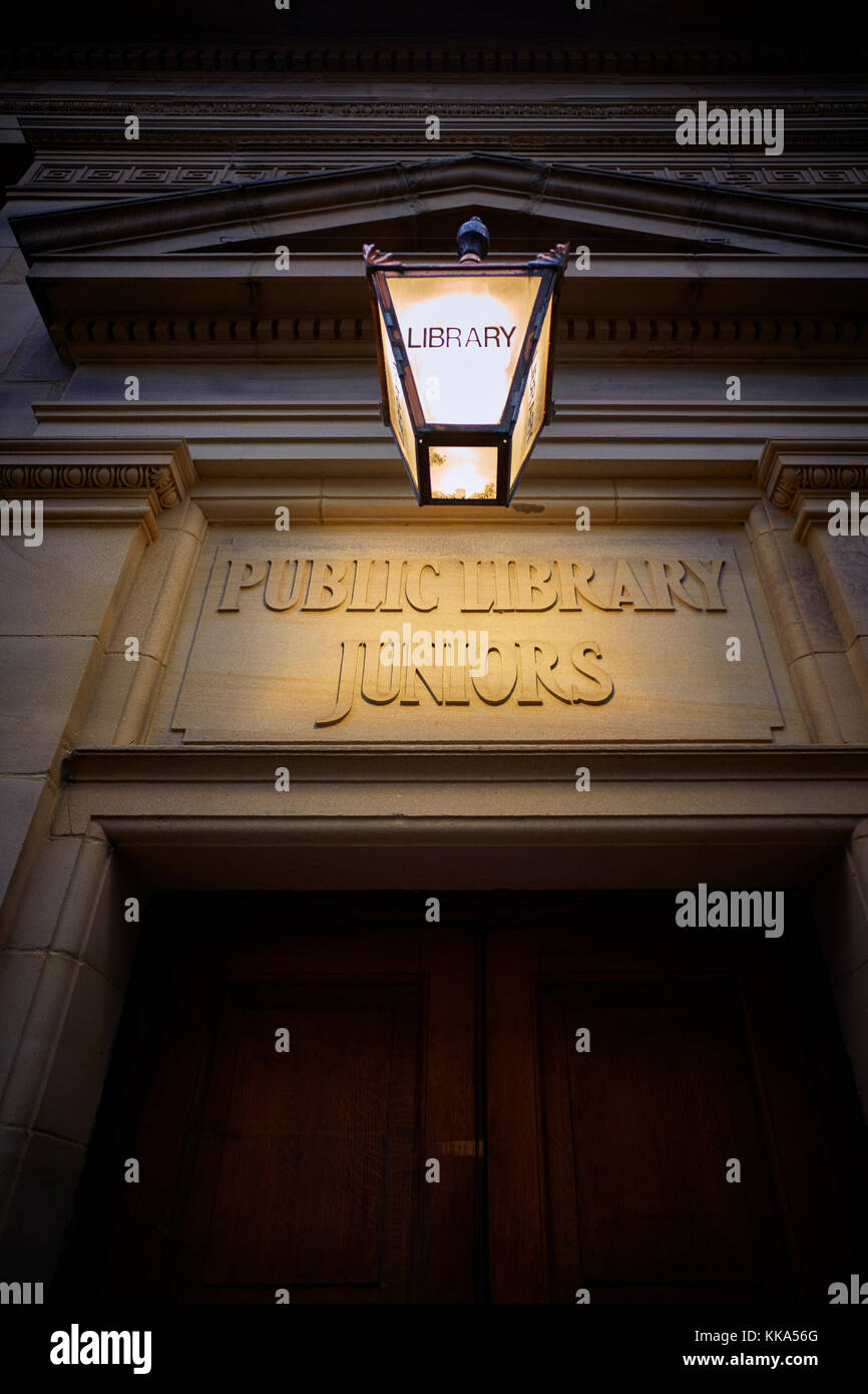 Public library juniors sign lit up in Lancaster Stock Photo