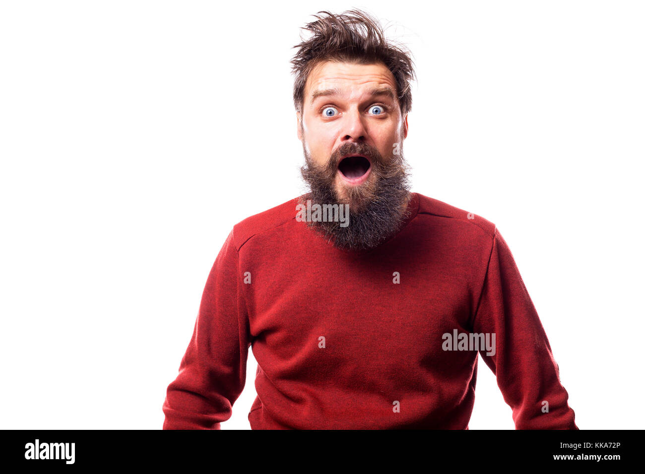 surprised man with disheveled  hair and beard on white backround Stock Photo