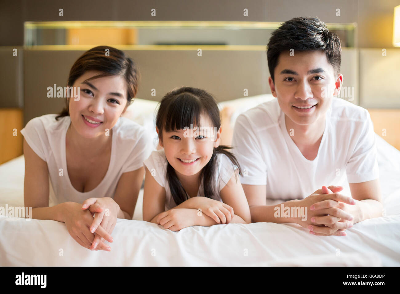 Portrait of happy young Chinese family Stock Photo