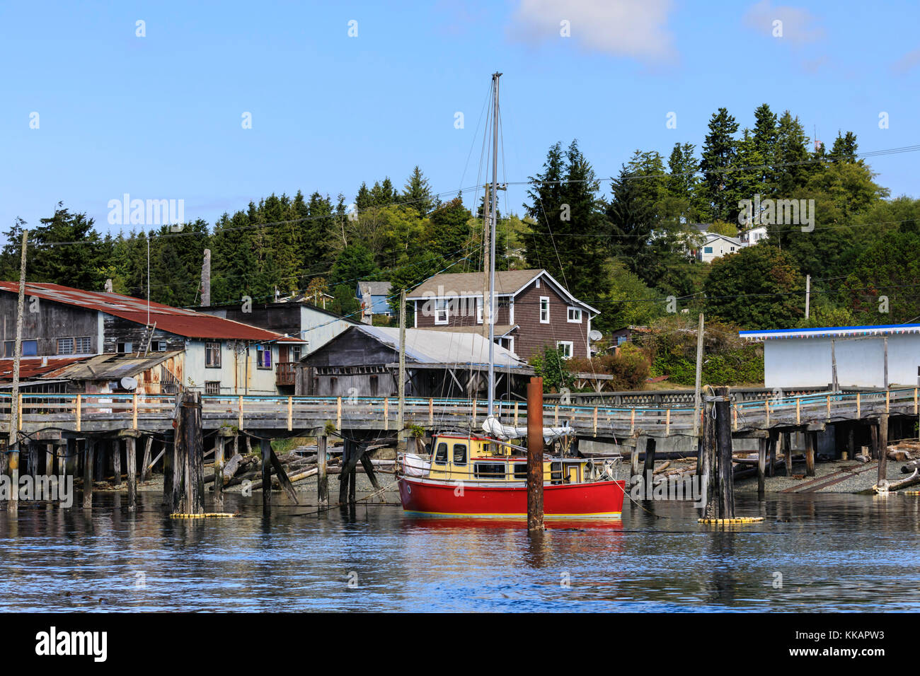 Red yacht, old dock buildings and jetty, Alert Bay, Cormorant Island ...