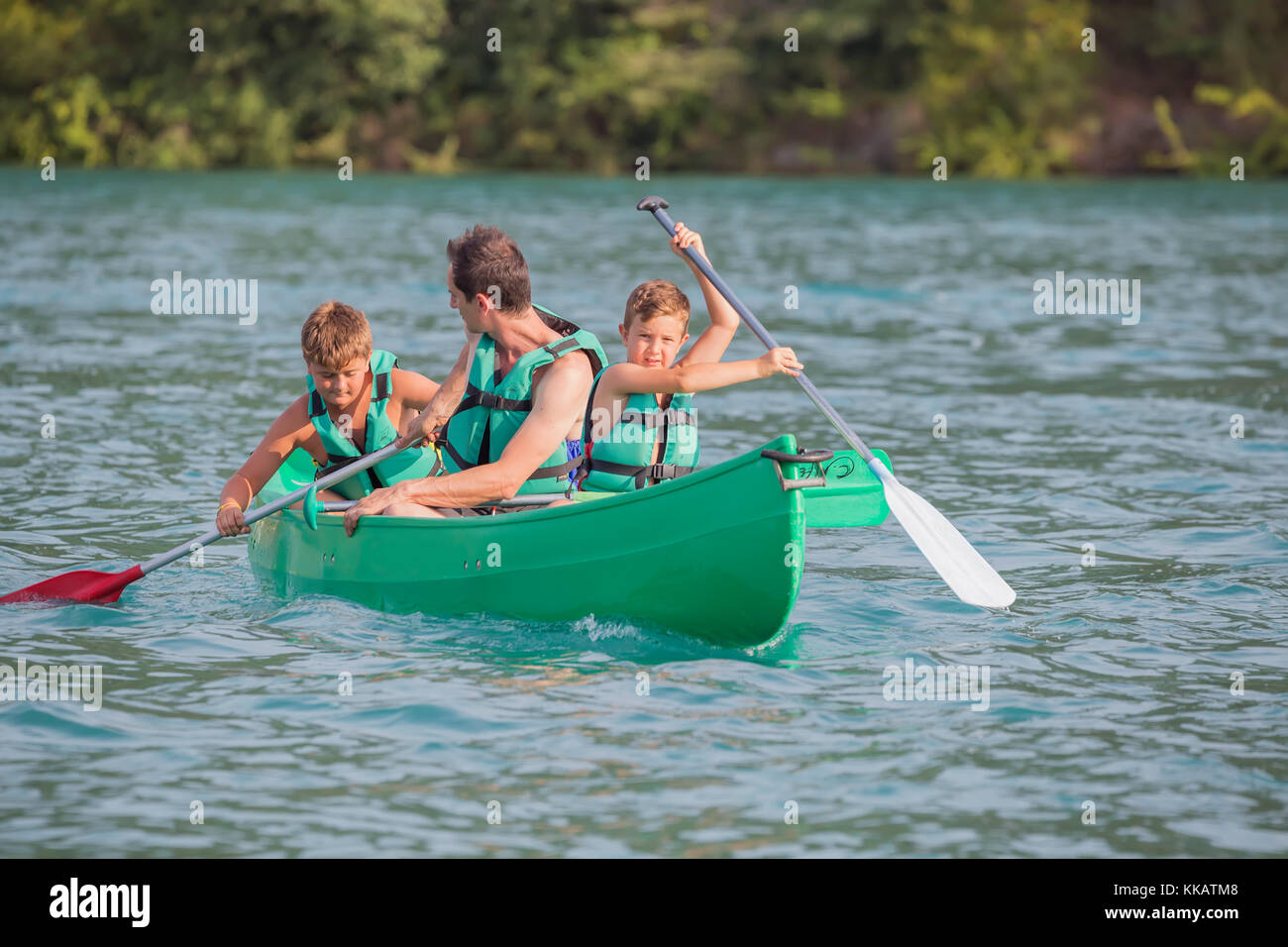 Family practising in a canoe, Esparron lake, Esparron de Verdon, Alpes de Haute Provence, France, Europe Stock Photo