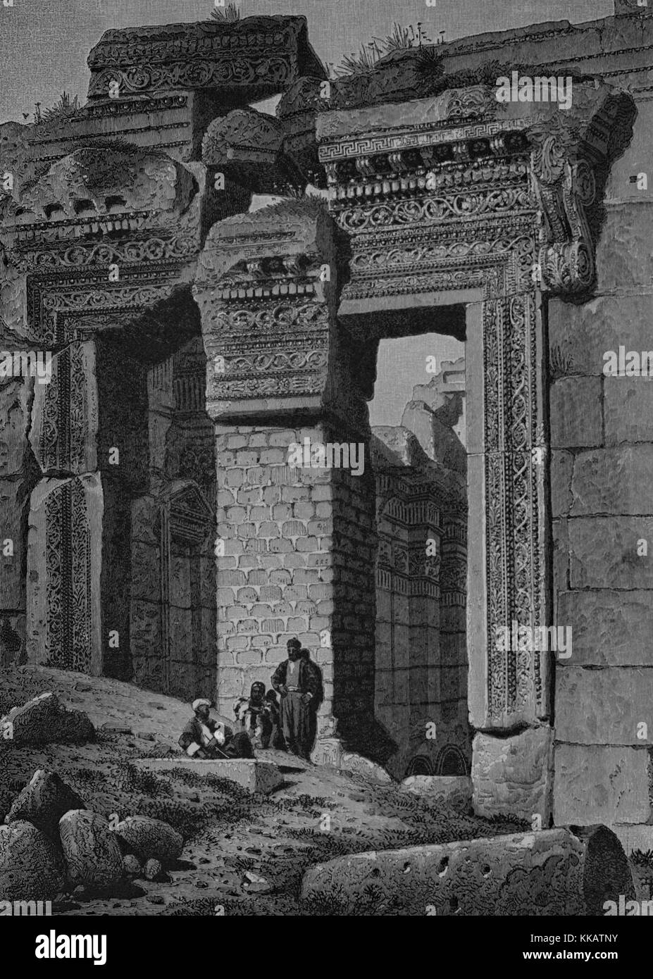 Wood engraving depicting a large stone entry, three men in front of it, captioned 'Gateway to the Temple of the Sun, Ba'albek, It is twenty-one feet in width, and forty-two feet high, The modern masonry, which supports the displaced keystone, conceals the crested eagle carved upon its soffit', from the book Picturesque Palestine, Sinai, and Egypt, by Sir Charles William Wilson, 1882. From the New York Public Library. Stock Photo