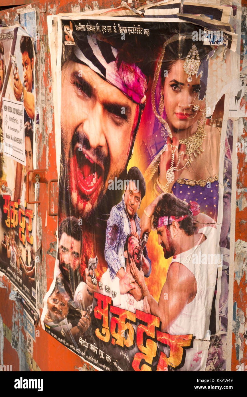 Bollywood movie poster posted in public place advertising latest film Stock Photo