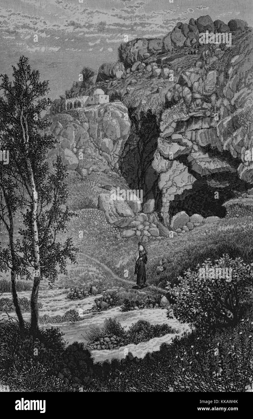 An engraving depicting the most easterly source of the river Jordan, a place of worship stands upon the rocks, Banias, Syria, 1882. From the New York Public Library. Stock Photo