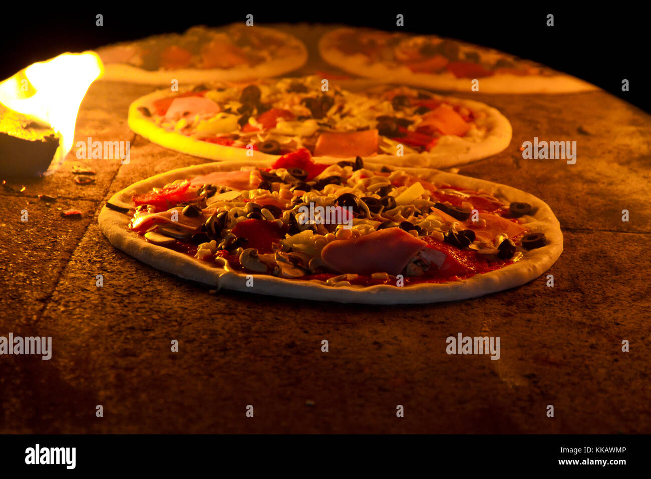 Pizza cooking in a tradition oven Stock Photo Alamy