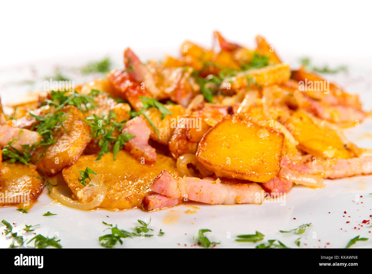 Potatoes and bacon cooked in the oven Stock Photo
