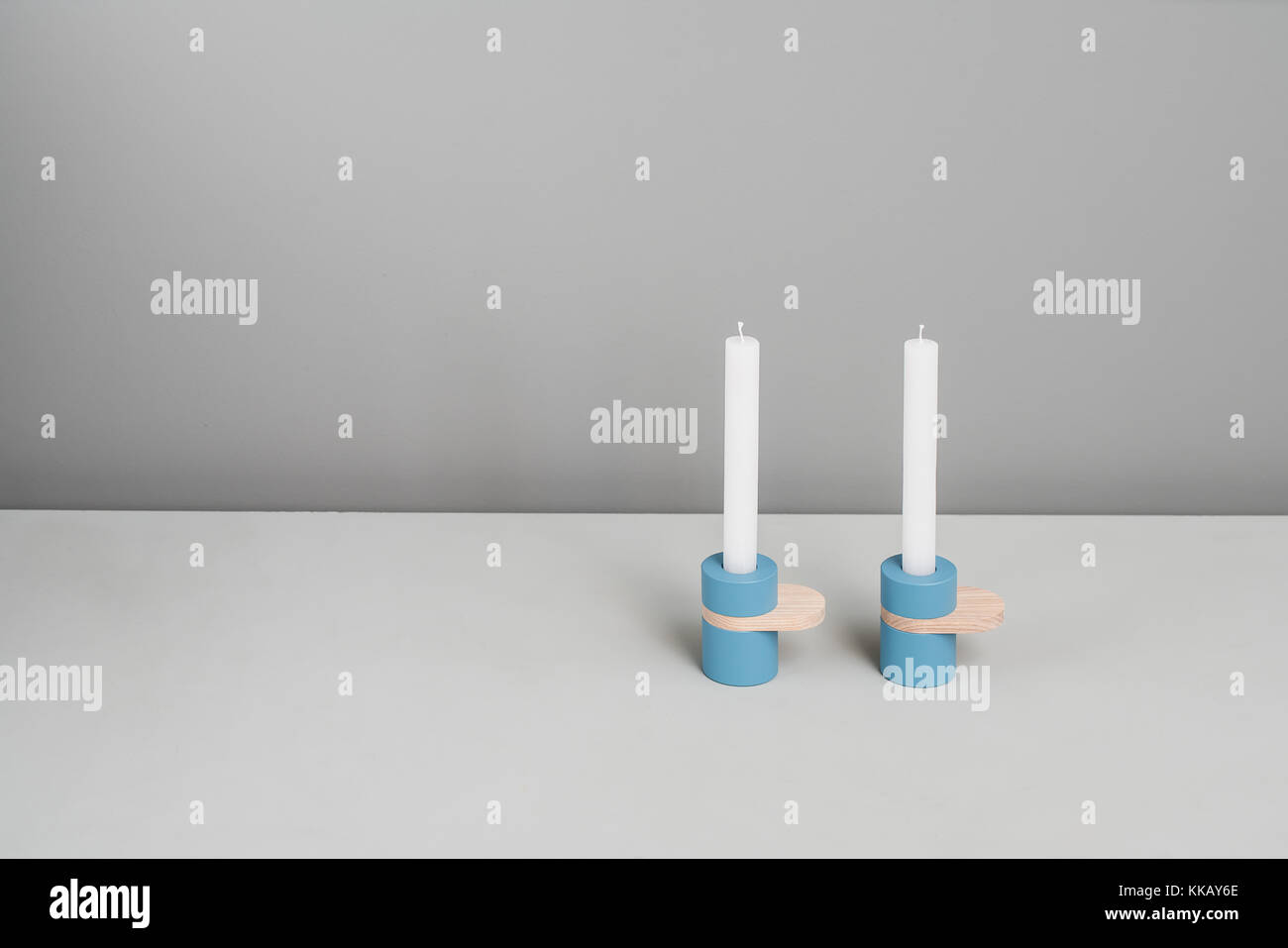 Blue candlesticks with wooden parts Stock Photo Alamy
