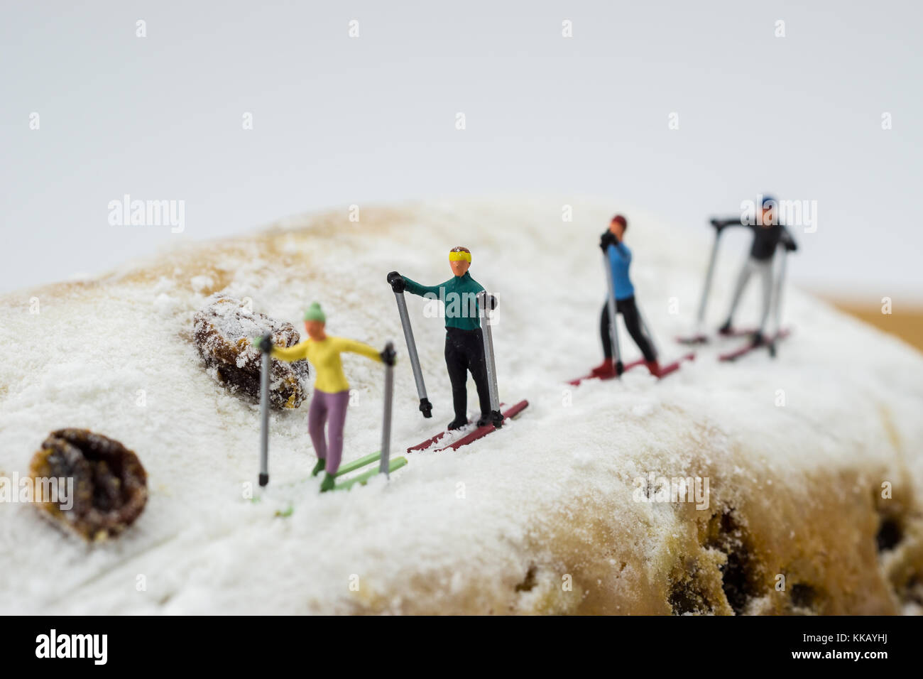 Miniature figure of a man skiing on winter snow on colorful red skis  surrounded by multiple shadows and copyspace Stock Photo - Alamy