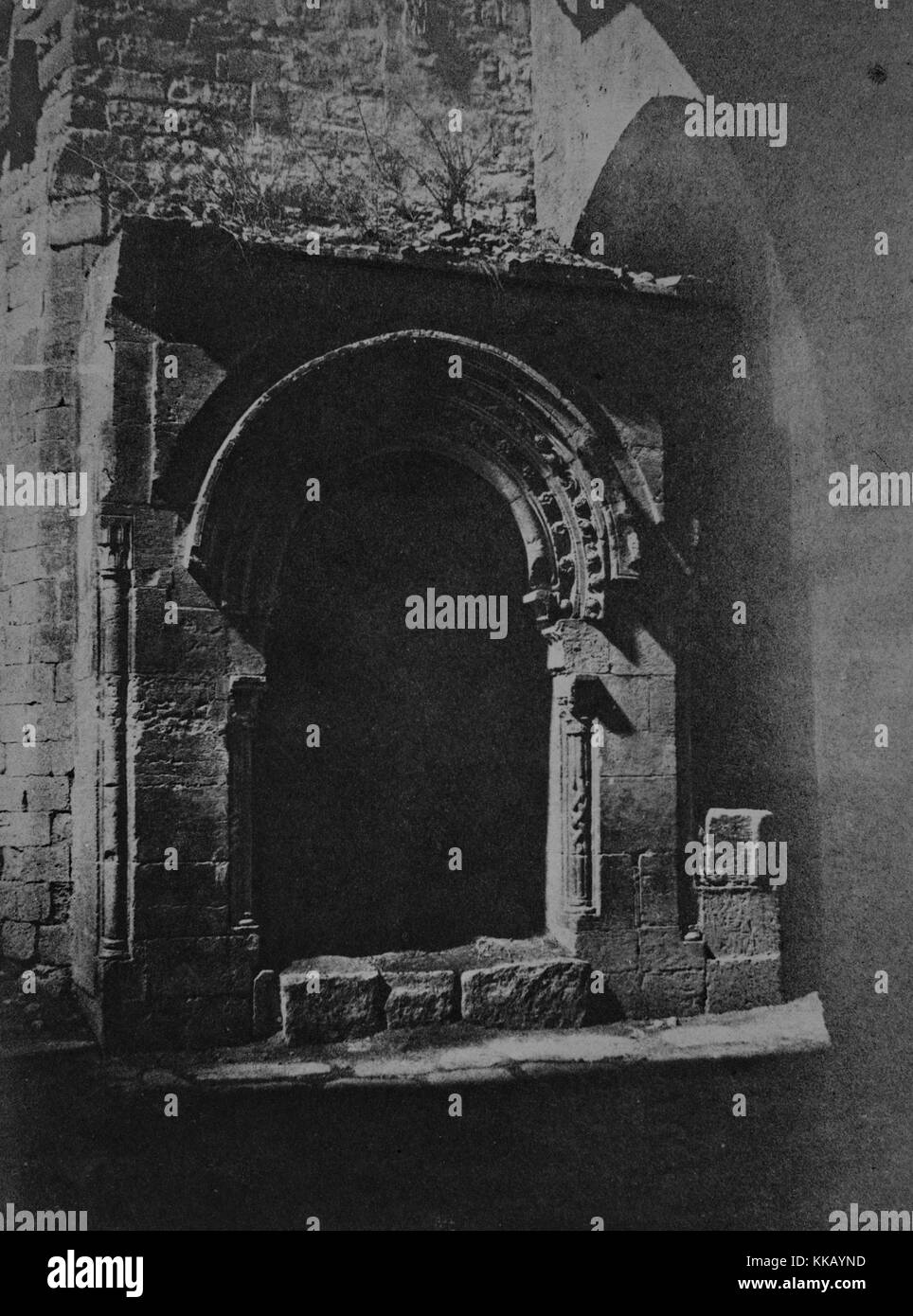 A photograph of an Arab fountain, the fountain was constructed to provide drinking water to Arabs making pilgrimages to holy sites in the city, the fountain itself is contained within a stone work archway and structure that have been constructed on the exterior of a building, Jerusalem, 1856. From the New York Public Library. Stock Photo