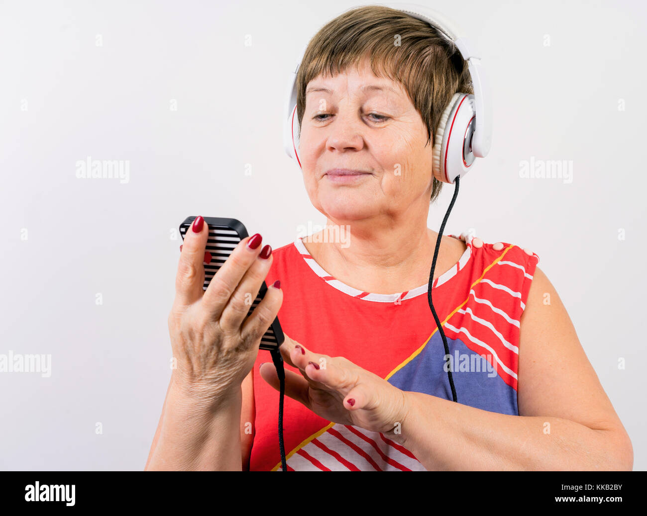 grandma in the headphones with the phone Stock Photo - Alamy