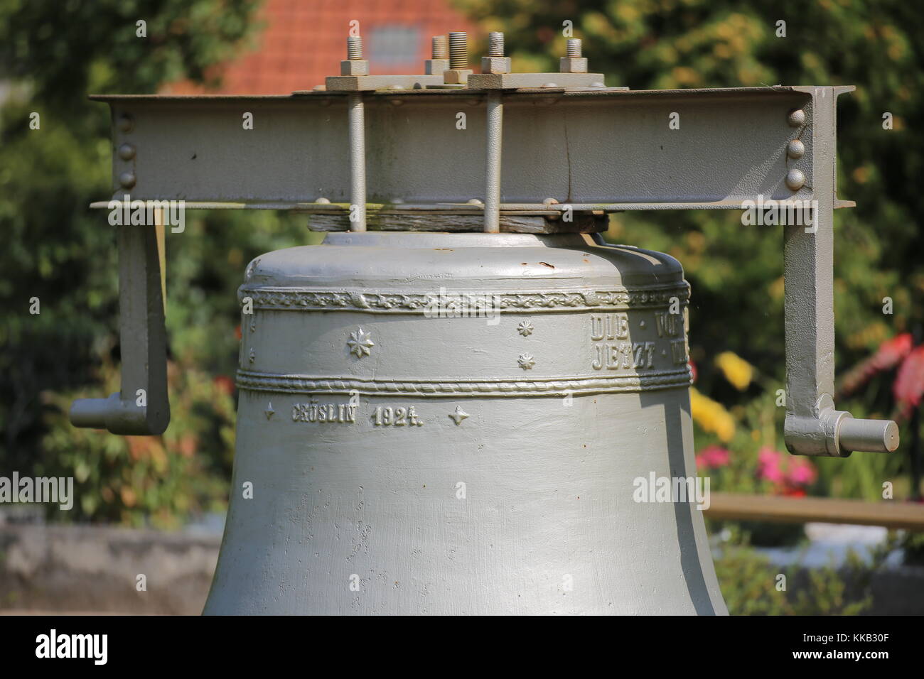 Historic church bell from 1924 on the cemetery of Kroeslin, Germany. Stock Photo