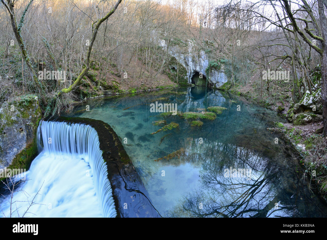 Springhead, cascade and clear, turquoise water of Krupaja river running out from the cave, fisheye landscape, Krupajsko vrelo, Serbia Stock Photo