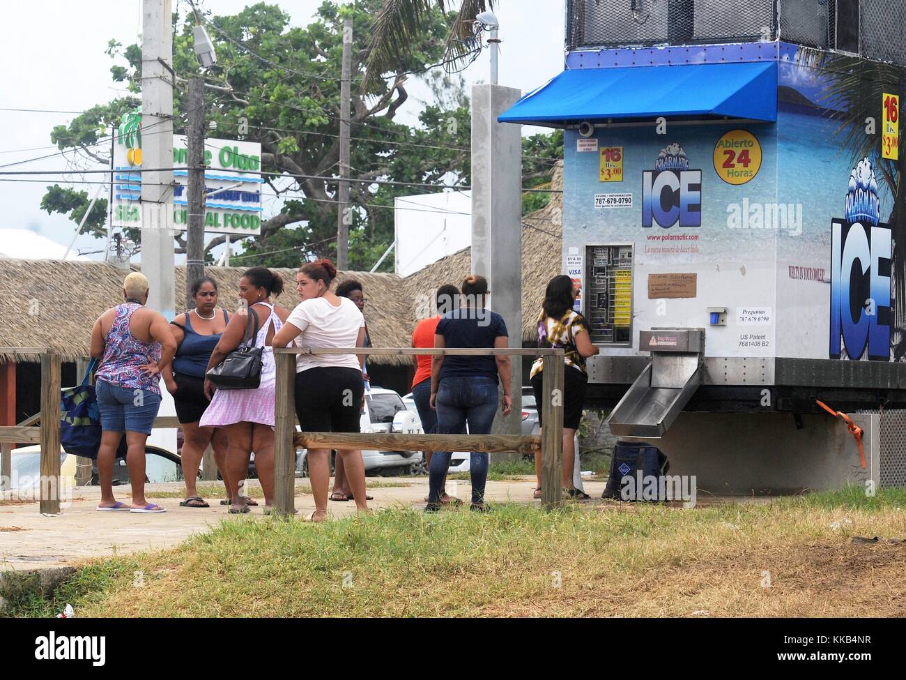 Puerto Rican residents purchase ice from an ice machine in the aftermath of Hurricane Maria November 20, 2017 in Playa Aviones, Loiza, Puerto Rico.  (photo by Steven Shepard via Planetpix) Stock Photo