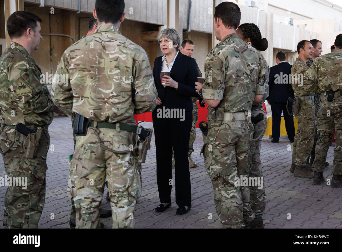 Prime Minister Theresa May speaks with soldiers at the Combined Joint