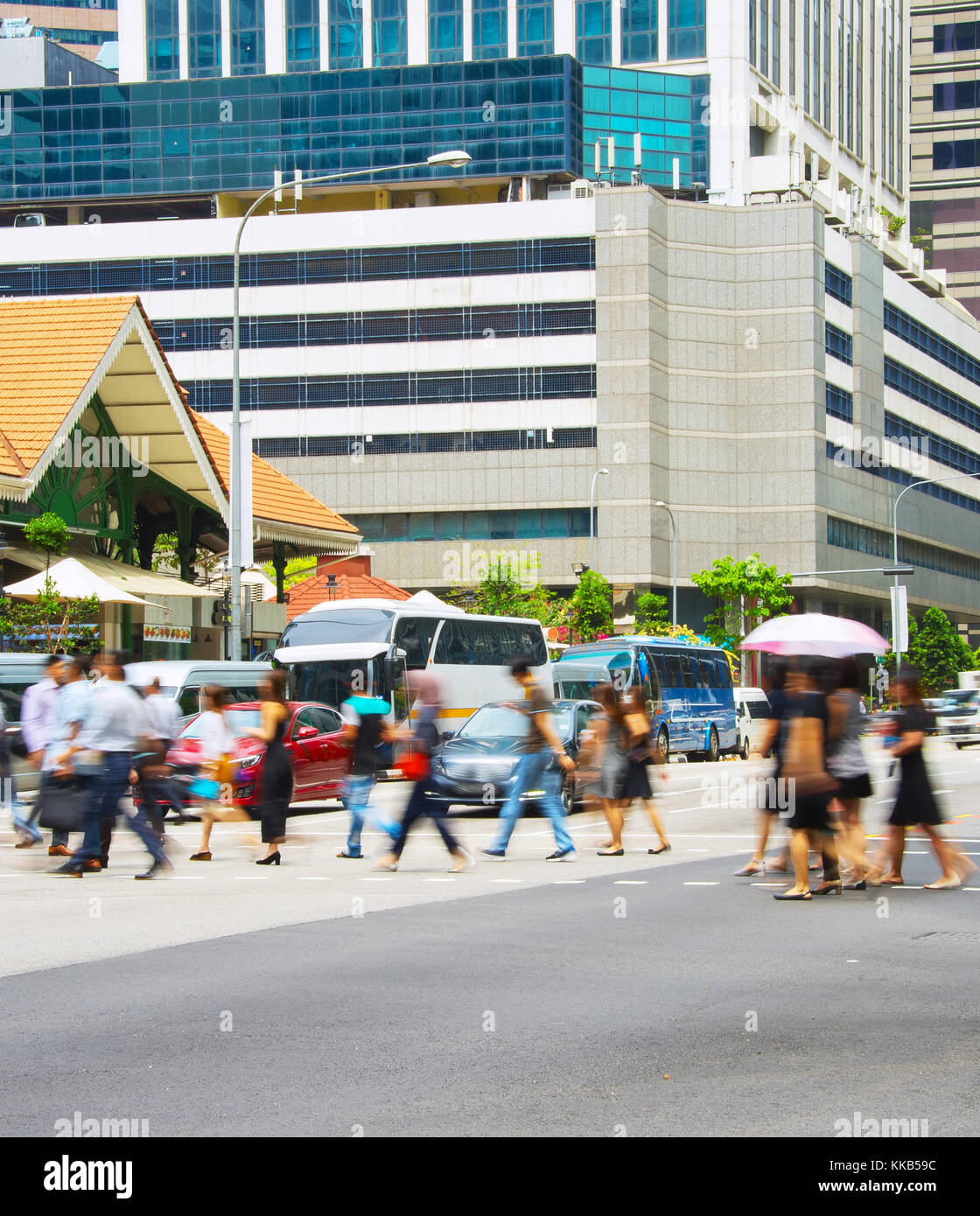 People crossing a road in Singapore business downtown Stock Photo - Alamy