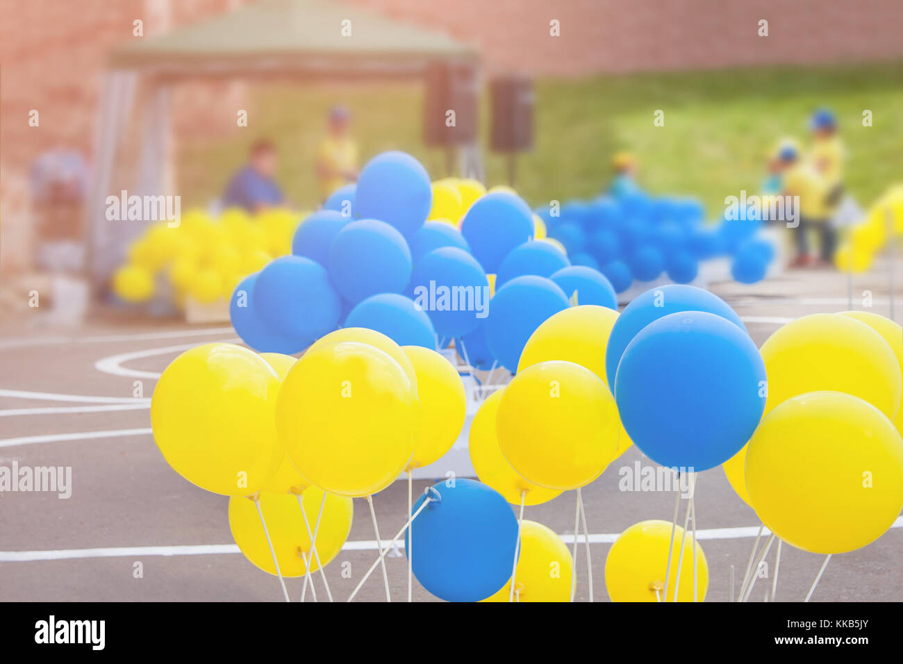 Yellow and blue balloons on the holiday of independence day on a Sunny day. Stock Photo