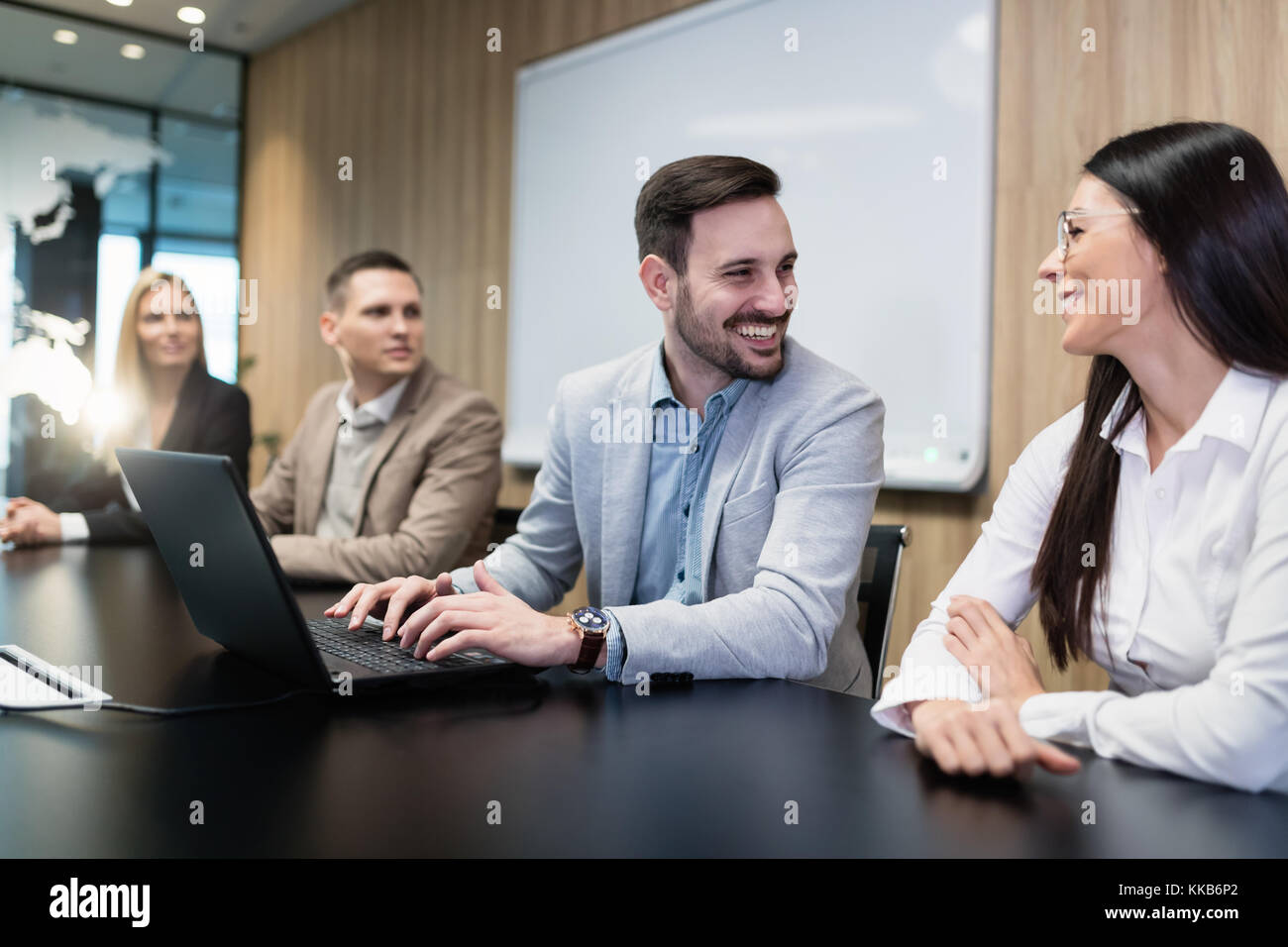 Businesspeople working on computer in conference room Stock Photo - Alamy