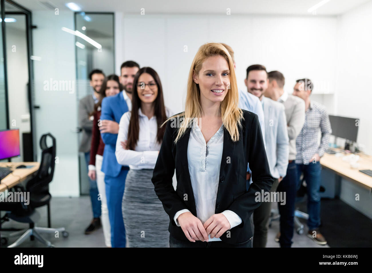 Group picture of business team posing in office Stock Photo - Alamy