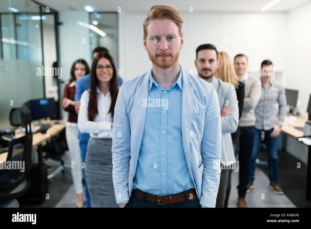Group picture of business team posing in office Stock Photo - Alamy