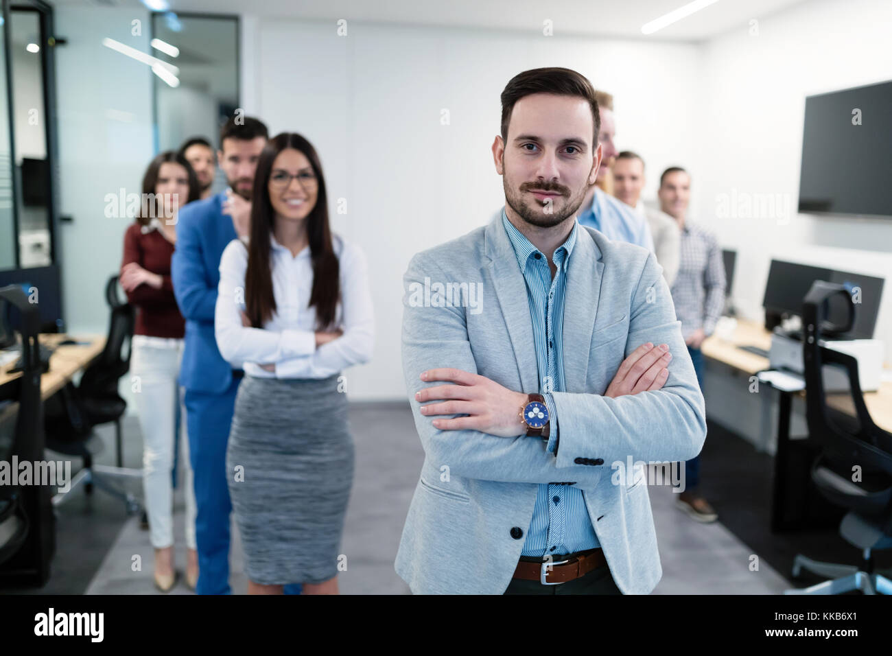Group picture of business team posing in office Stock Photo - Alamy