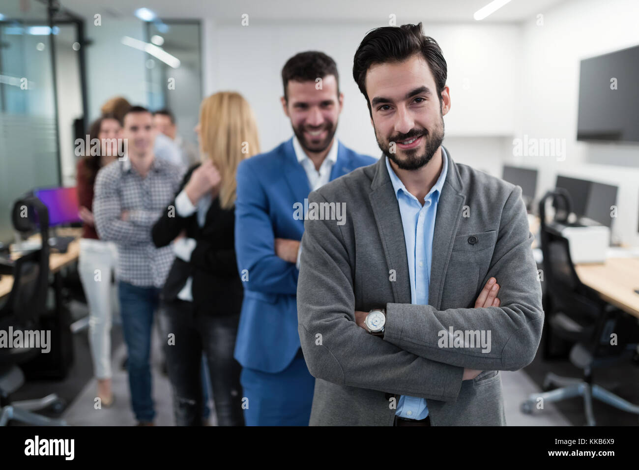 Group picture of business team posing in office Stock Photo - Alamy